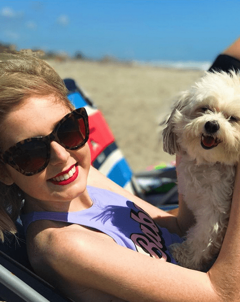 Annie McMahon at Rockaway Beach with dog