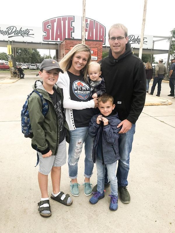 Eric Storms with his wife and 3 sons